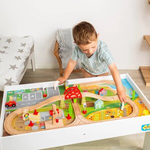 Wielki zestaw torów kolejowych na drewnianym stole Bigjigs Rail